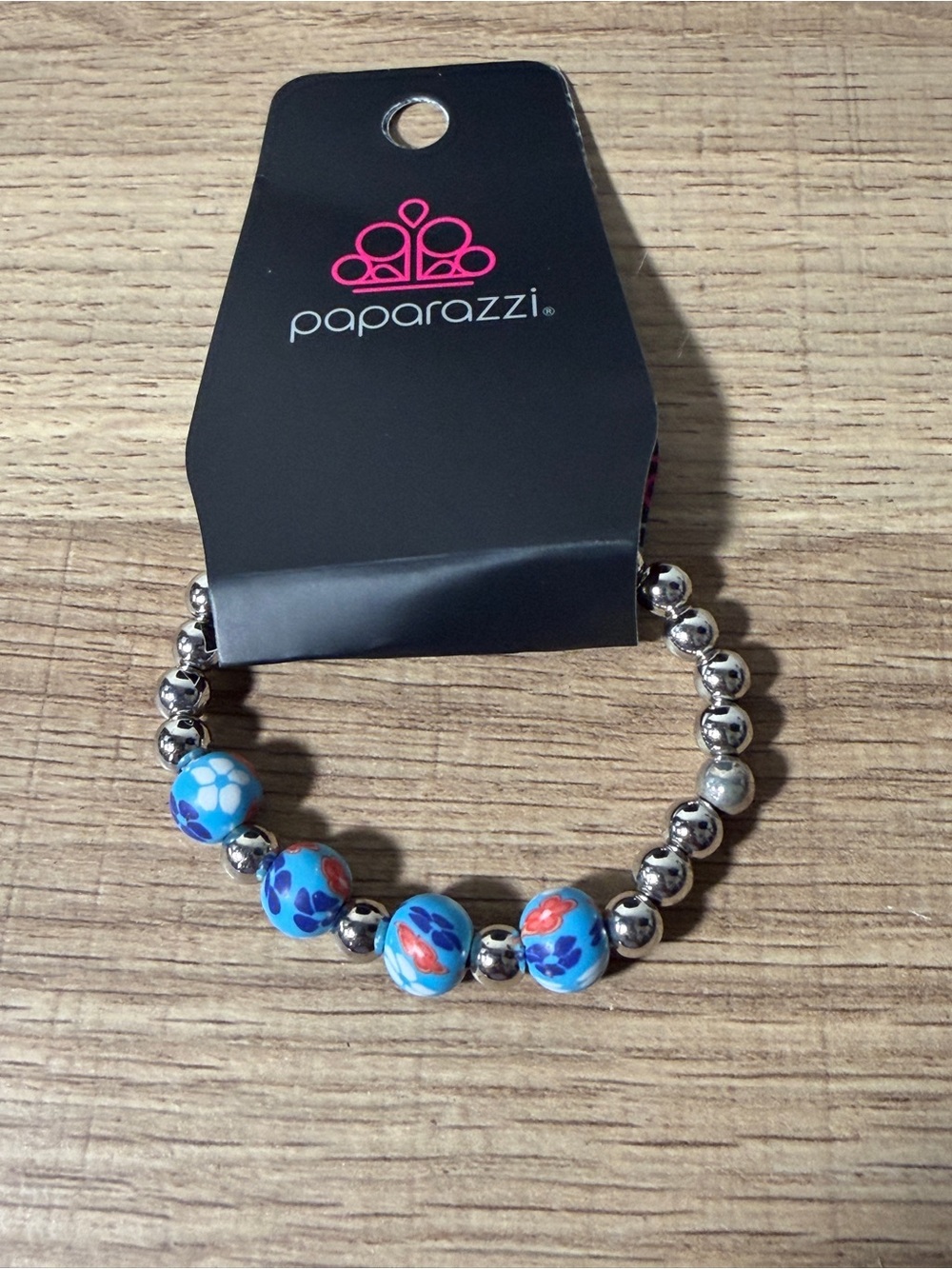 paparazzi Blue Floral Stretch Bracelet with Silver Beads and Red Accents